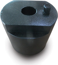 Black cylindrical object with hole in top